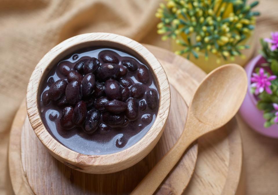 healthy sweet black bean coconut milk soup in a wooden bowl