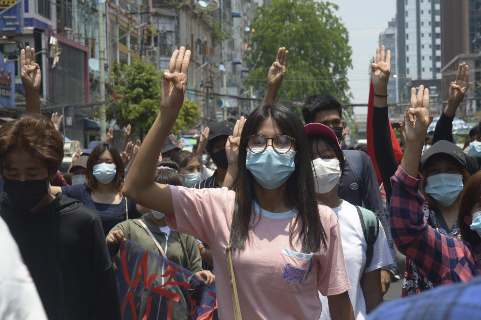 Anti-coup protesters flash the three-finger sign of defiance during a demonstration in Yangon, Myanmar, on Friday, April 23, 2021. Leaders of the 10-member Association of Southeast Asian Nations meet Saturday, April 24, in Jakarta to consider plans to promote a peaceful resolution of the conflict that has wracked Myanmar since its military launched a deadly crackdown on opponents to its seizure of power in February. (AP Photo)