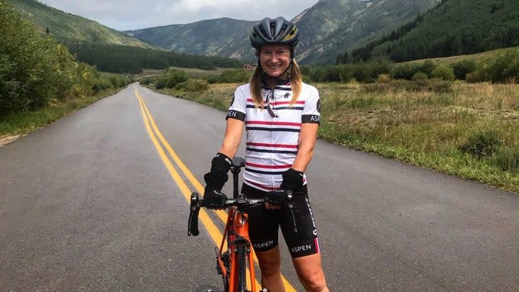 The author posing by her bicycle