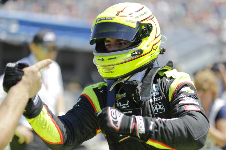 Simon Pagenaud, of France, is congratulated by a member of his crew after he qualified for the Indianapolis 500 IndyCar auto race at Indianapolis Motor Speedway, Saturday, May 18, 2019, in Indianapolis. (AP Photo/Darron Cummings)