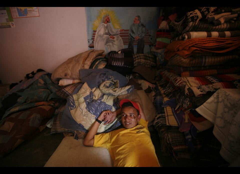 In this May 12, 2012 photo, Eric Acosta, a migrant from Honduras, recovers from a fall he suffered while trying to climb a north bound train, at a migrant shelter in Lecheria, on the outskirts of Mexico City. While the number of Mexicans heading to the U.S. has dropped dramatically, a surge of Central American migrants is making the 1,000-mile northbound journey this year, fueled in large part by the rising violence brought by the spread of Mexican drug cartels. (AP Photo/Marco Ugarte)  