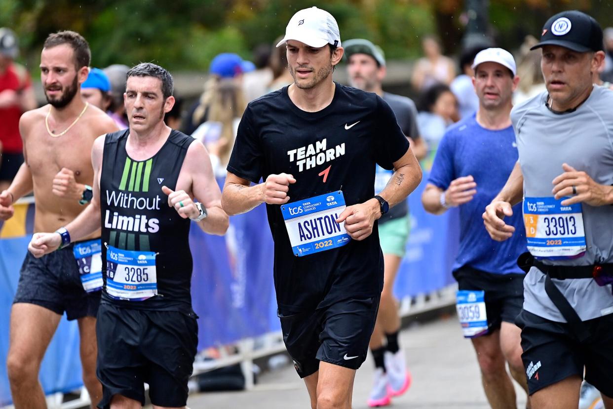 Ashton Kutcher runs during the 2022 TCS New York City Marathon on November 06, 2022 in New York City.