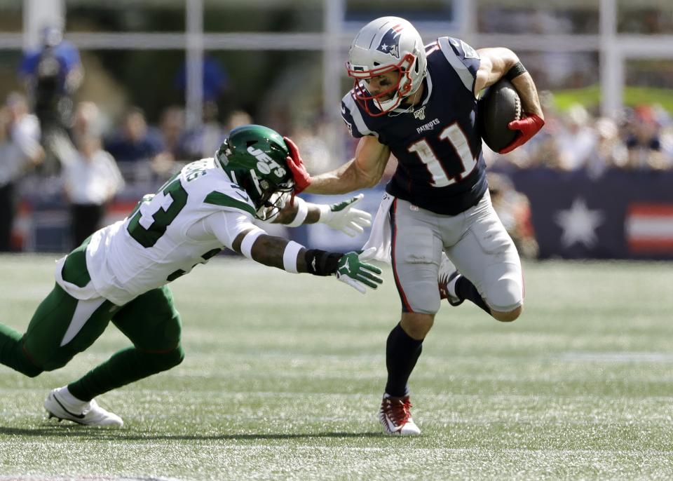 New England Patriots wide receiver Julian Edelman, right, tries to escape the grasp of New York Jets safety Jamal Adams in the first half of an NFL football game, Sunday, Sept. 22, 2019, in Foxborough, Mass. (AP Photo/Steven Senne)