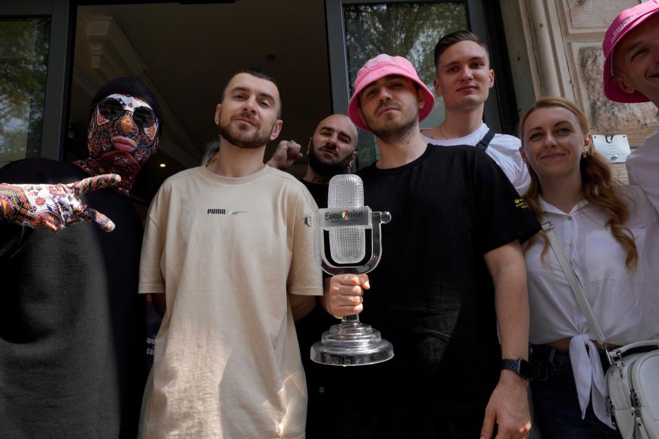 Kalush Orchestra of Ukraine pose with the Eurovision trophy (AP)