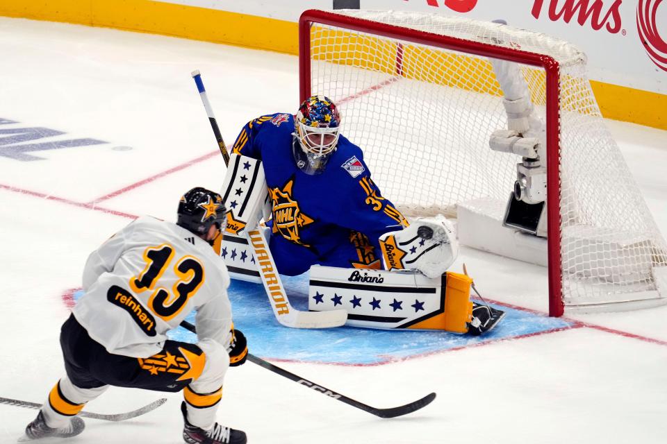 Feb 3, 2024; Toronto, Ontario, CAN; Team Matthews goalkeeper Igor Shesterkin (31) of the New York Rangers makes a save against Team McDavid center Sam Reinhart (13) of the Florida Panthers in the 2024 NHL All-Star Game at Scotiabank Arena.