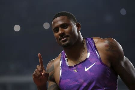 David Oliver of the U.S reacts after winning the men's 110m hurdles event at the IAAF Diamond League Athletics in Shanghai May 17, 2015. REUTERS/Aly Song