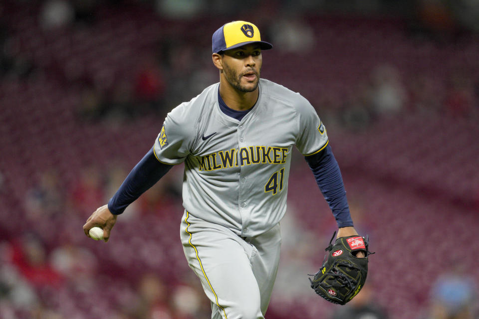 Milwaukee Brewers pitcher Joe Ross prepares to toss the ball to first for the out on Cincinnati Reds' Jeimer Candelario during the sixth inning of a baseball game Tuesday, April 9, 2024, in Cincinnati. (AP Photo/Jeff Dean)