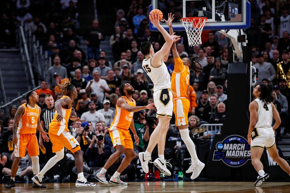 Purdue center Zach Edey (15) makes a jump shot against Tennessee forward Jonas Aidoo (0) during the second half of the NCAA tournament Midwest Regional Elite 8 round at Little Caesars Arena in Detroit on Sunday, March 31, 2024.