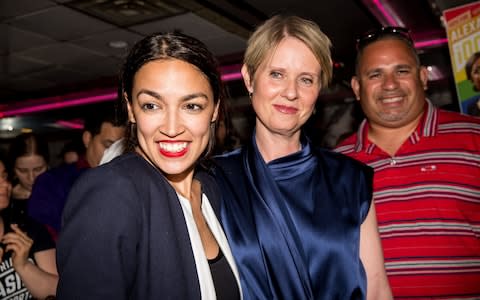  Progressive challenger Alexandria Ocasio-Cortez is joined by New York gubenatorial candidate Cynthia Nixon at her victory party in the Bronx  - Credit: Getty