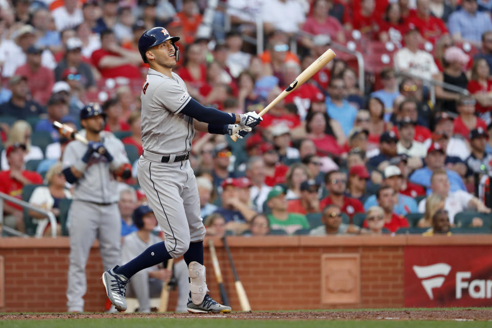 Houston Astros' Carlos Correa watches his grand slam during the third inning of a baseball game against the St. Louis Cardinals, Saturday, July 27, 2019, in St. Louis. (AP Photo/Jeff Roberson)