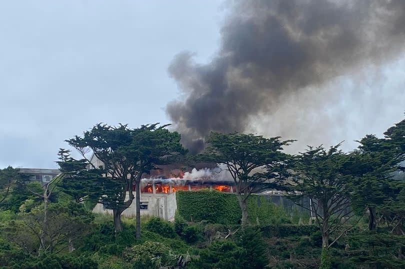 The Hotel California in Newquay is on fire and smoke is billowing from its roof