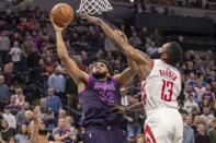 Feb 13, 2019; Minneapolis, MN, USA; Minnesota Timberwolves center Karl-Anthony Towns (32) shoots the ball over Houston Rockets guard James Harden (13) in the second half at Target Center. Jesse Johnson-USA TODAY Sports