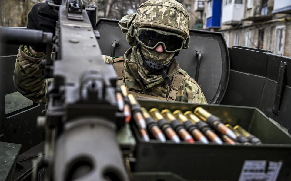 Ukrainian soldier aims a machine gun in Chasiv Yar, Bakhmut, Donetsk Oblast - Muhammed Enes Yildirim/Anadolu Agency via Getty Images