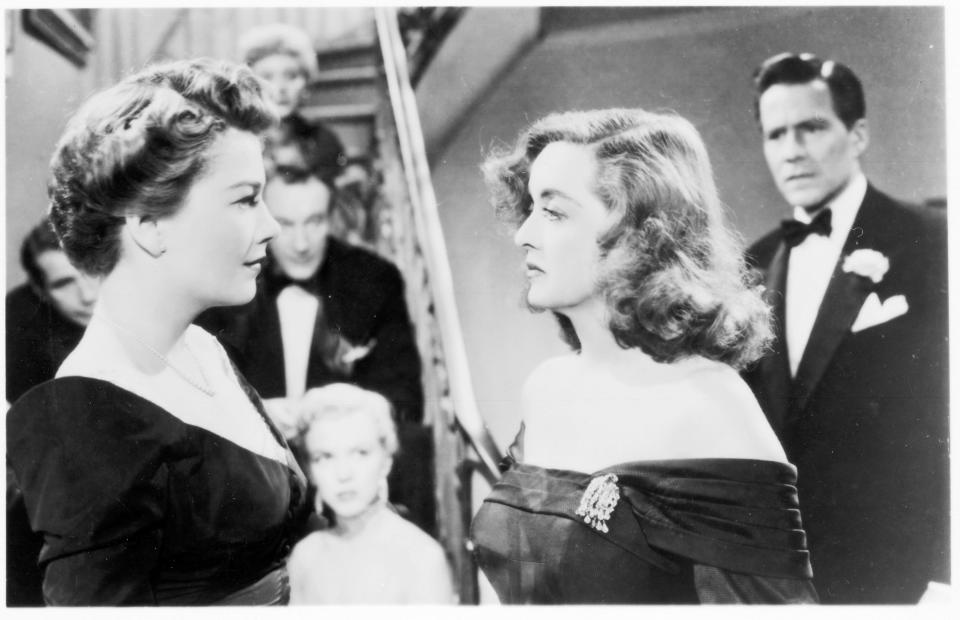 An ambitious understudy (Anne Baxter, left) sets her sights on the stardom of a Broadway actress (Bette Davis) in "All About Eve."