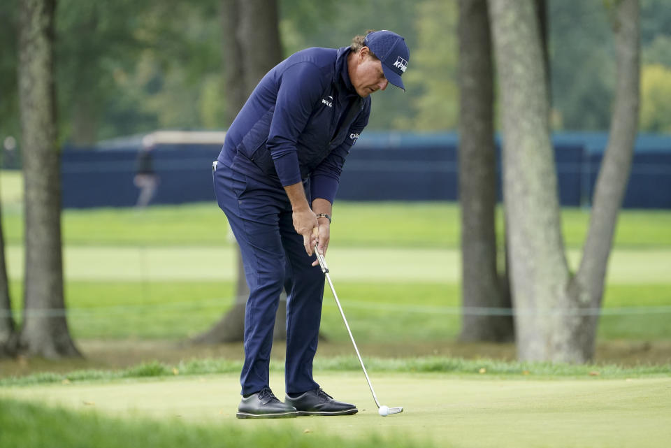 Phil Mickelson, of the United States, putts on the second green during the second round of the US Open Golf Championship, Friday, Sept. 18, 2020, in Mamaroneck, N.Y. (AP Photo/John Minchillo)