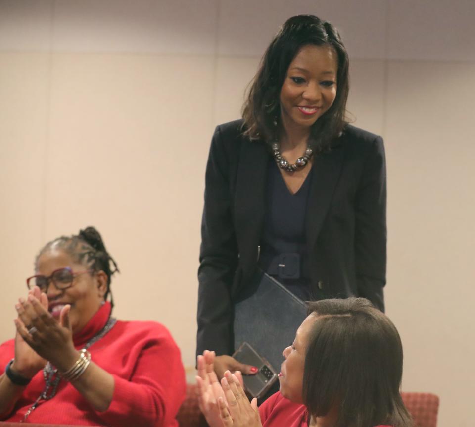 Montrella Jackson was introduced by Mayor Shammas Malik on Wednesday as the city's new human resources director during a news conference at the Ocasek Building auditorium. Congratulating her are Esther Thomas, director of diversity, equity and inclusion, left, and Summer Hall, cultural engagement coordinator.