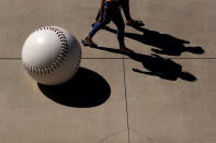 People enter Peoria Sports Complex before a spring training baseball game between the San Diego Padres and the Chicago Cubs, Monday, March 1, 2021, in Peoria, Ariz. (AP Photo/Charlie Riedel)