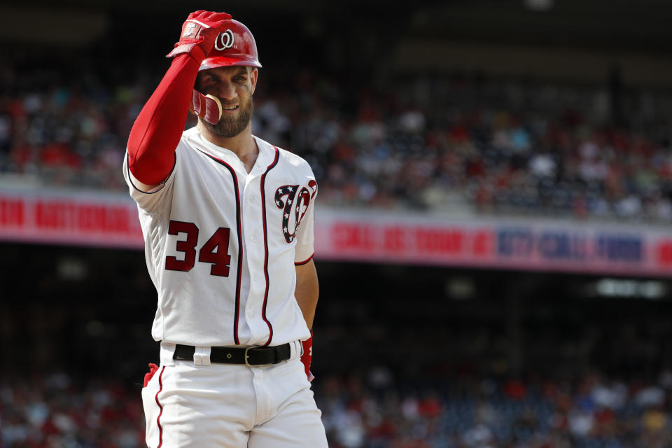 Washington Nationals' Bryce Harper (34) steps out of the batter's box during the eighth inning of a baseball game against the Cincinnati Reds at Nationals Park, Sunday, Aug. 5, 2018, in Washington. (AP Photo/Jacquelyn Martin)