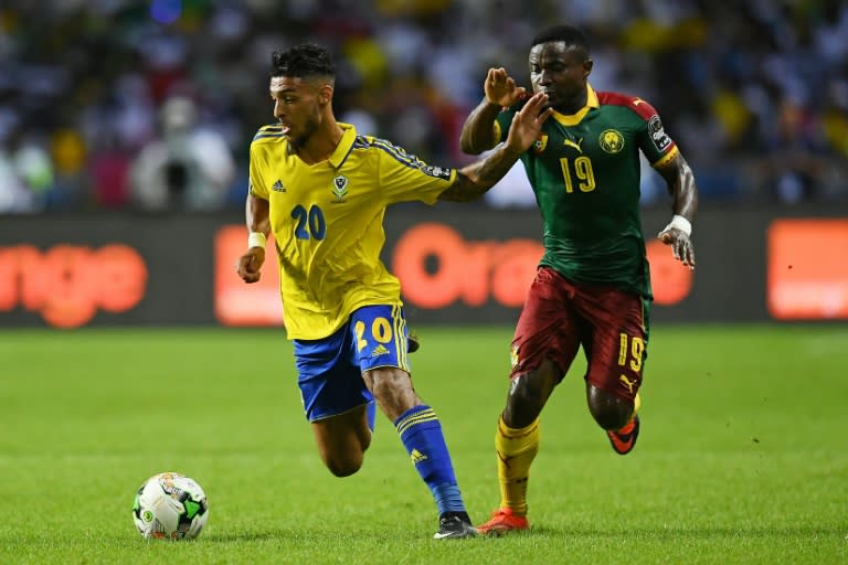 Cameroon's defender Collins Fai (R) challenges Gabon's forward Denis Bouanga during the 2017 Africa Cup of Nations group A football match between Cameroon and Gabon at the Stade de l'Amitie Sino-Gabonaise in Libreville on January 22, 2017