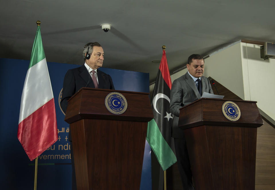 Abdul Hamid Dbeibeh, the Prime Minister of the Government of National Unity, right, and Mario Draghi, the Prime Minister of Italy, speak to media, Tuesday, April, 6 2021 in Tripoli, Libya. (AP Photo/Nada Harib)