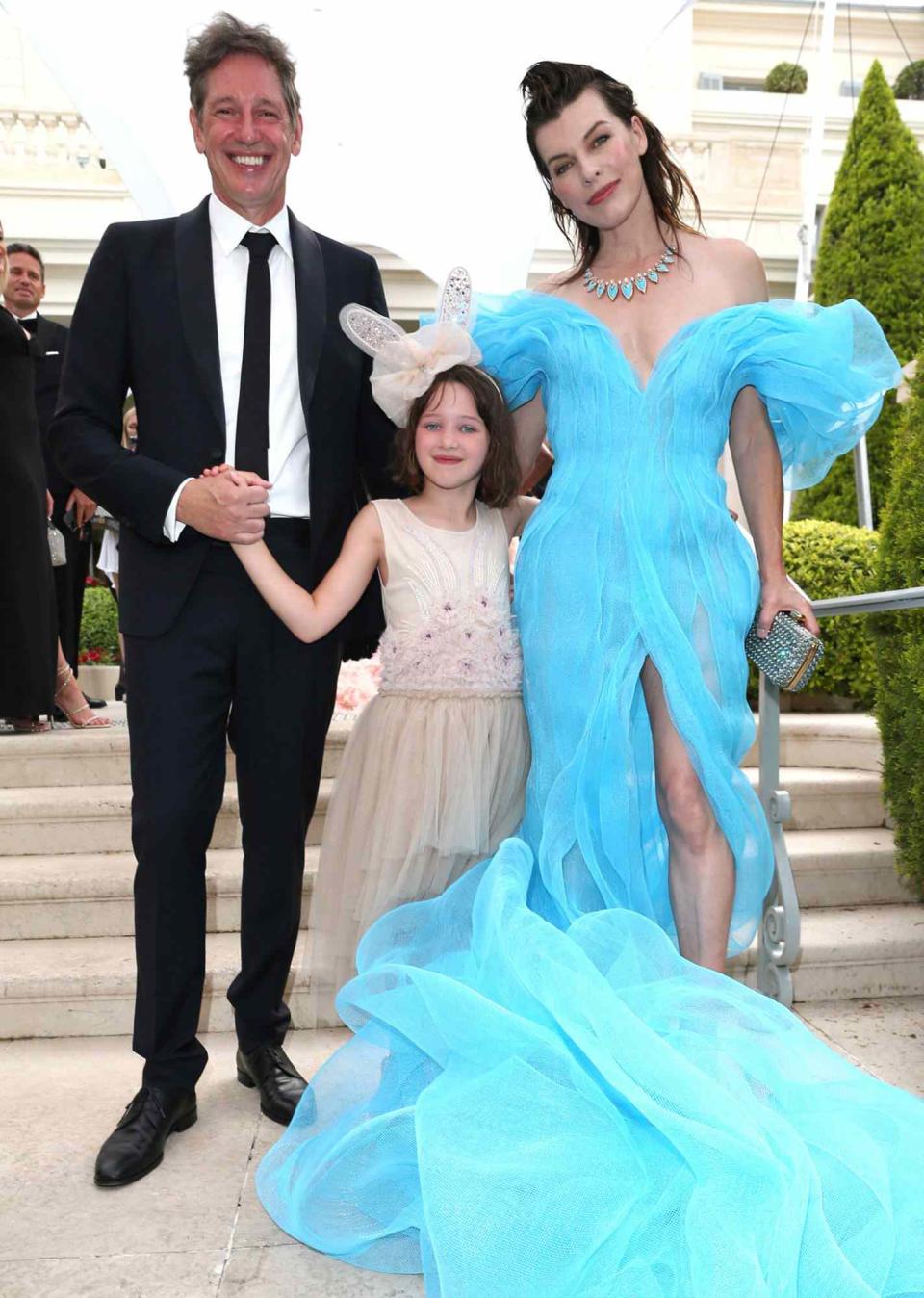Paul W. S. Anderson, Dashiel Anderson and Milla Jovovich attend the amfAR Cannes Gala 2022