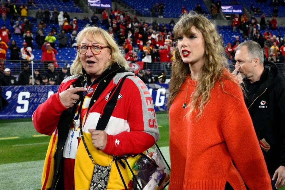 Taylor Swift, right, walks with potential mother-in-law Donna Kelce following Sunday night's game (AP)
