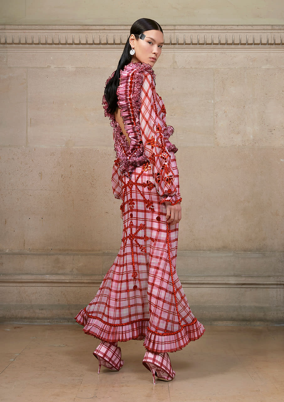 <p>Long dress in silk chiffon printed with a pink and red tartan pattern, delicate plissé soleil at the waist, neck and hem and embellished with red mirror-effect crystals. (Photo: Courtesy of Givenchy) </p>