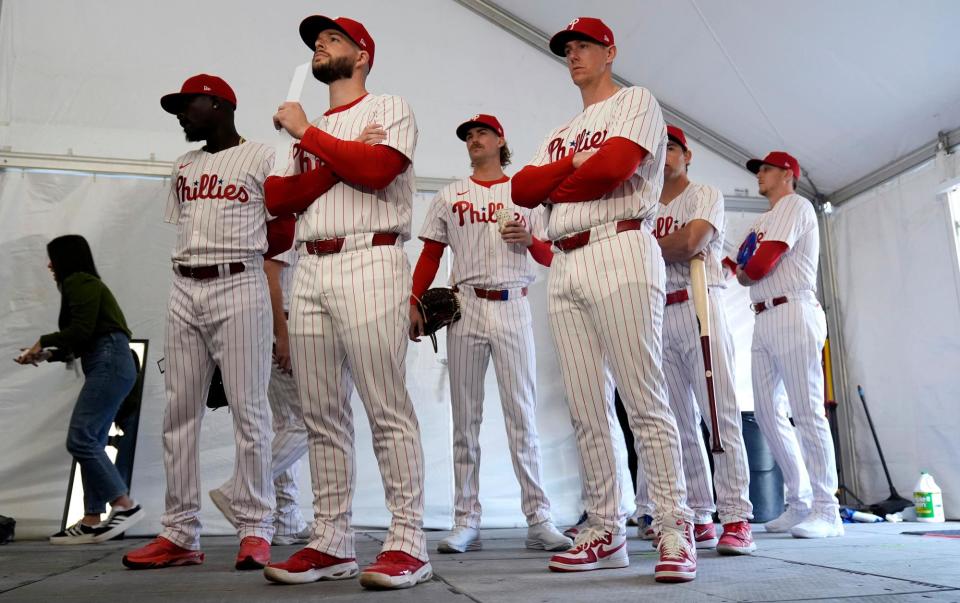<span><a class="link " href="https://sports.yahoo.com/mlb/teams/philadelphia/" data-i13n="sec:content-canvas;subsec:anchor_text;elm:context_link" data-ylk="slk:Philadelphia Phillies;sec:content-canvas;subsec:anchor_text;elm:context_link;itc:0">Philadelphia Phillies</a> players wait to have their photo taken during a spring training photo day last month.</span><span>Photograph: Charlie Neibergall/AP</span>