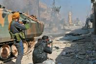 Turkey-backed fighters push with their advance on the Syrian city of al-Bab, on February 22, 2017