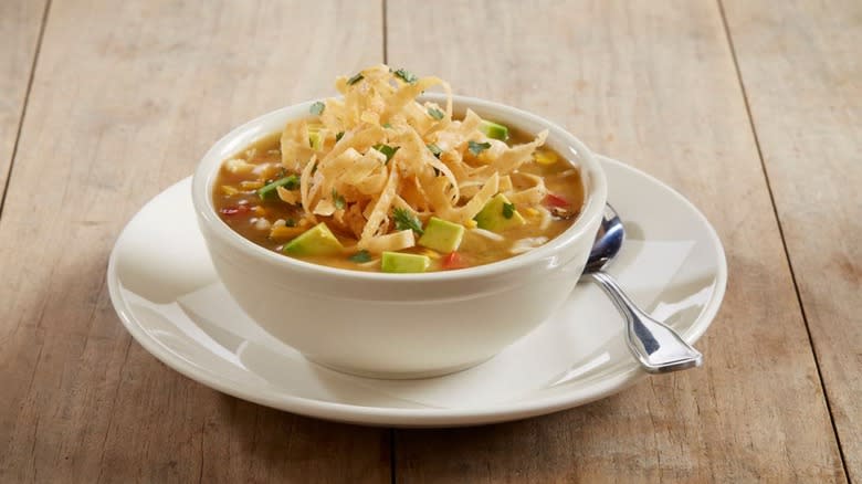 Bowl of chicken tortilla soup with tortilla strips