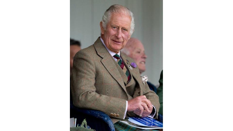 king charles smiling in tweed jacket at mey highland games