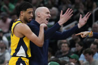 Indiana Pacers head coach Rick Carlisle reacts to his bench as guard Tyrese Haliburton (0) follows behind during the first quarter of Game 1 of the NBA Eastern Conference basketball finals against the Boston Celtics, Tuesday, May 21, 2024, in Boston. (AP Photo/Charles Krupa)