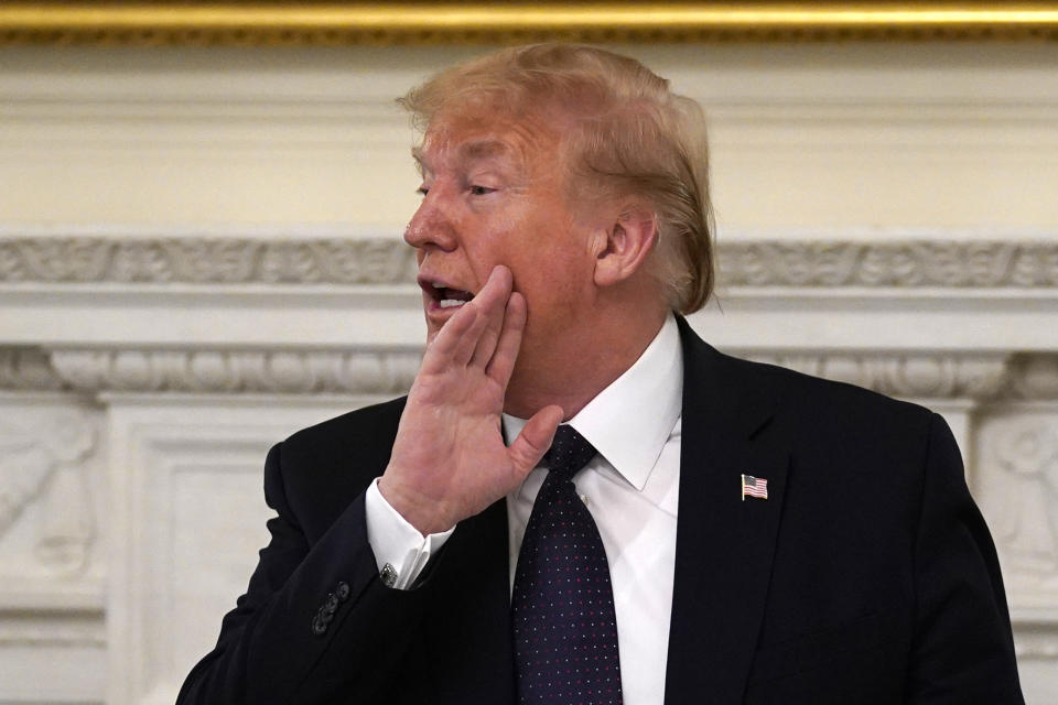 <p>President Donald Trump gestures as he leaves a meeting with restaurant industry executives about the coronavirus response, in the State Dining Room of the White House, Monday, May 18, 2020, in Washington. (AP Photo/Evan Vucci)</p>
