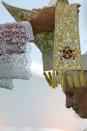 A mitre is placed on Pope Benedict XVI during an open-air mass in Beirut. The pontiff prayed on Sunday that Middle East leaders work towards peace and reconciliation, stressing again the central theme of his visit to Lebanon, whose neighbour Syria is engulfed in civil war