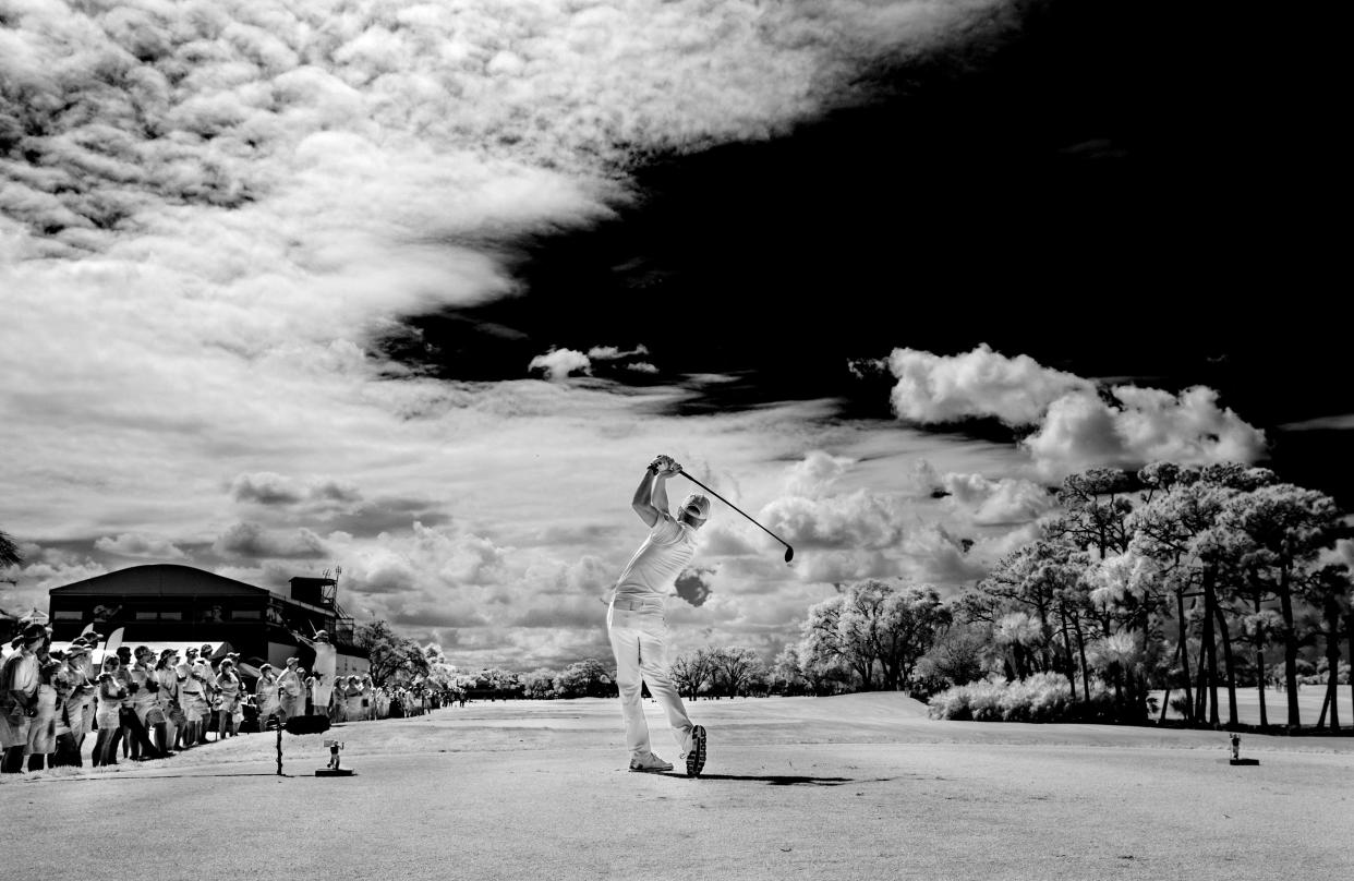A golfer tees off at the Honda Classic in Palm Beach Gardens, February 24, 2018. Photograph was made with a camera converted to infrared.