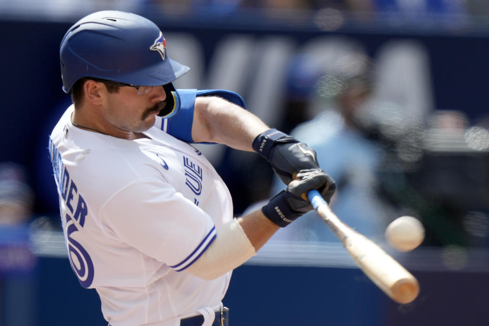 Toronto Blue Jays second baseman Davis Schneider (36) hits a two-run home run during the sixth inning of a baseball game against the Cleveland Guardians in Toronto, Sunday, Aug. 27, 2023. (Frank Gunn/The Canadian Press via AP)