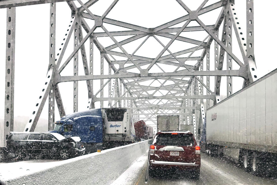 In this photo released by the Missouri State Highway Patrol, a multi-vehicle pileup on Interstate 70 on the bridge that spans the Missouri River near Rocheport, Mo., is shown during a winter storm, Wednesday, Feb. 5, 2020. (Missouri State Highway Patrol via AP)