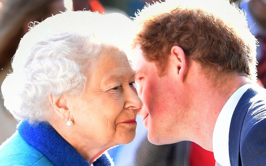 Prince Harry kisses his grandmother in a photograph taken in 2015 - JULIAN SIMMONDS  