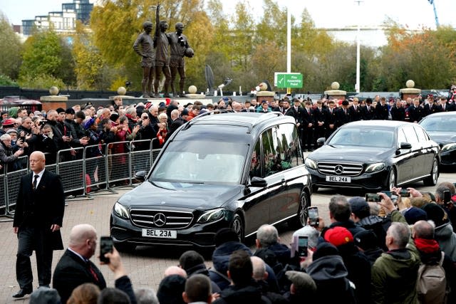 The funeral procession passes Old Trafford (Nick Potts/PA)