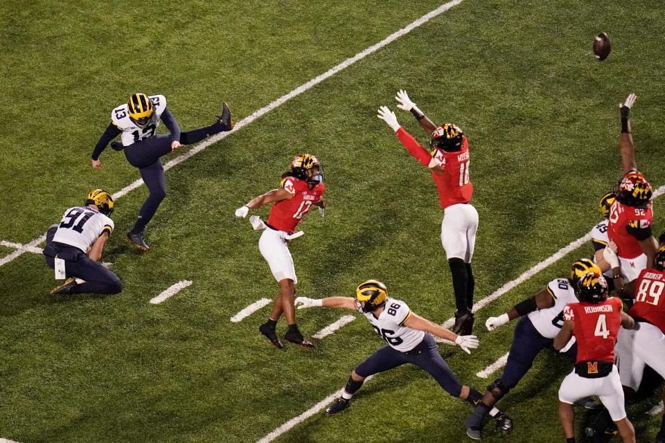 Michigan place kicker Jake Moody (13) kicks a field goal against Maryland during the first half Saturday, Nov. 20, 2021, in College Park, Md.