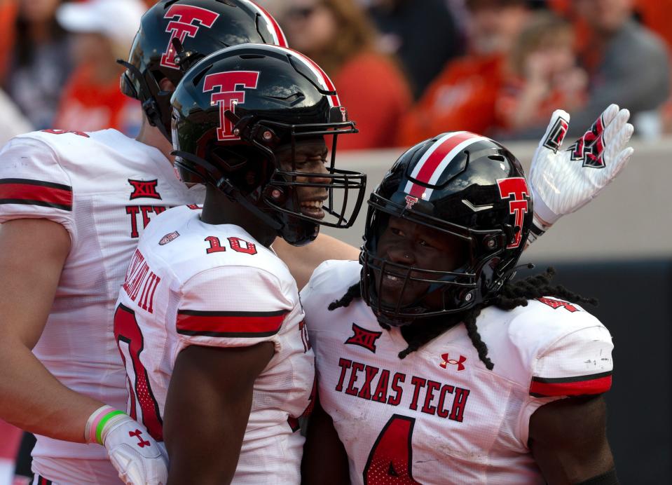 Texas Tech wide receiver Trey Cleveland (10) and running back SaRodorick Thompson (4) celebrate a Thompson touchdown during the Red Raiders' 41-31 loss Saturday at Oklahoma State. Cleveland caught nine passes for 100 yards, both career highs. Thompson carried 20 times for 87 yards, a 13-game high dating to the middle of last season.