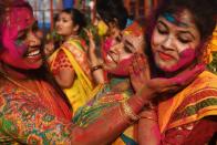 <p>Indian students celebrate the festival of Holi in Kolkata with multicolored powder on February 26, 2018. Holi is the popular Hindu spring festival of colors observed at the end of the winter season on the last full moon of the lunar month, and was celebrated on March 1 this year.</p>