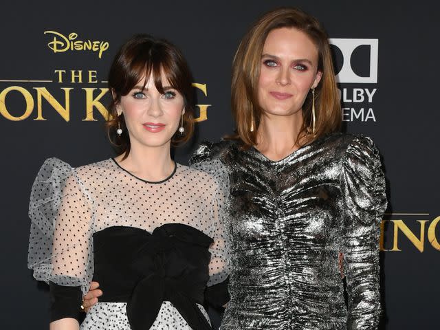 <p>Jon Kopaloff/FilmMagic</p> Zooey Deschanel and Emily Deschanel attend the Premiere Of Disney's "The Lion King" on July 09, 2019 in Hollywood, California.