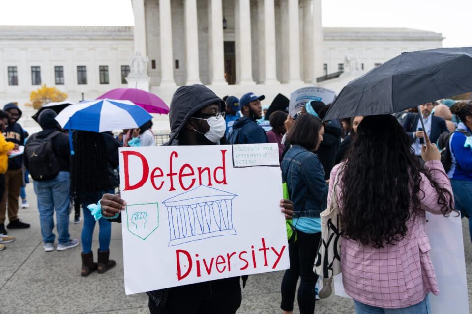 Protesters gather in front of the U.S. Supreme Court as affirmative action cases involving Harvard and University of North Carolina admissions are heard by the court in Washington on Monday, October 31, 2022. (Bill Clark/CQ-Roll Call, Inc via Getty Images)