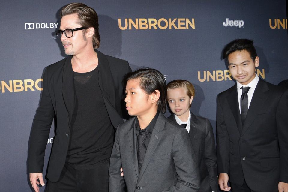 Brad Pitt and children Pax Jolie-Pitt (L), Shiloh Jolie-Pitt (C) and Maddox Jolie-Pitt arrive for the U.S. premiere of Universal Pictures 