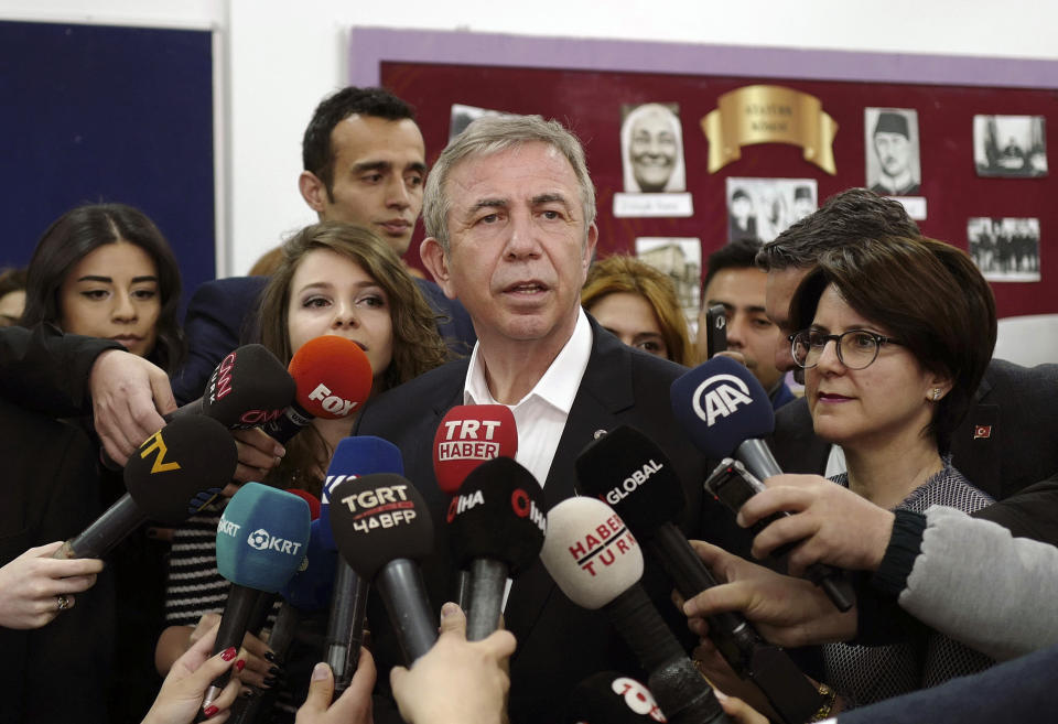 Mansur Yavas, the Ankara mayoral candidate of Turkey's main opposition alliance talks to the media after he casts his ballot at a polling station during the local elections in Ankara, Turkey, Sunday, March 31, 2019. Turkish citizens have begun casting votes in municipal elections for mayors, local assembly representatives and neighborhood or village administrators that are seen as a barometer of Erdogan's popularity amid a sharp economic downturn. (AP Photo/Burhan Ozbilici)