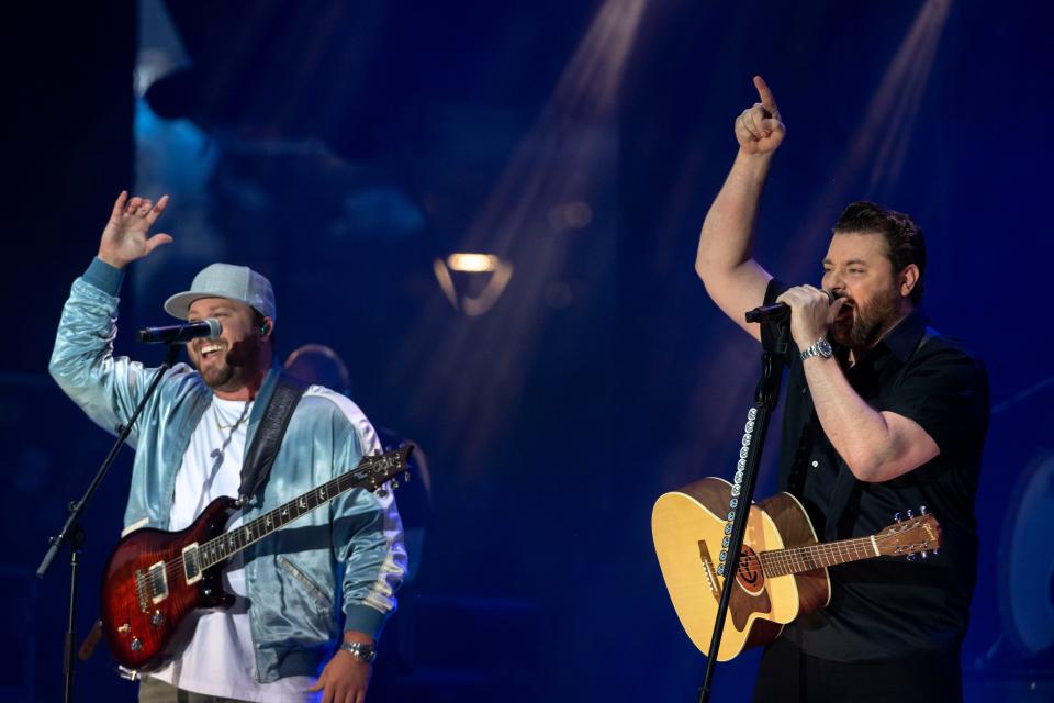Mitchell Tenpenny and Chris Young perform in downtown Nashville, Tenn., during the filming of a music video for "At The End of a Bar," a new song off Young's upcoming "Famous Friends" album, on Monday, July 5, 2021.