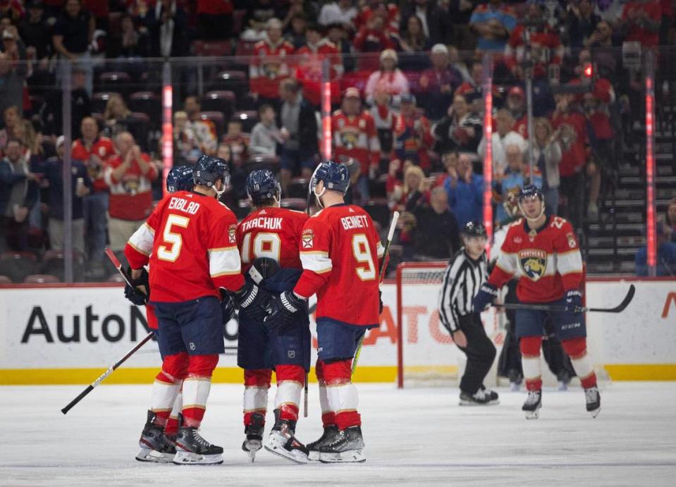 Florida Panthers defenseman Aaron Ekblad (5) and center Sam Bennett (9) congratulate left wing Matthew Tkachuk (19) on a goal during the first period of a hockey game on Wednesday, Jan. 24, 2024, at Amerant Bank Arena in Sunrise, Fla.