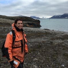 Woman in survival suit outside in Arctic