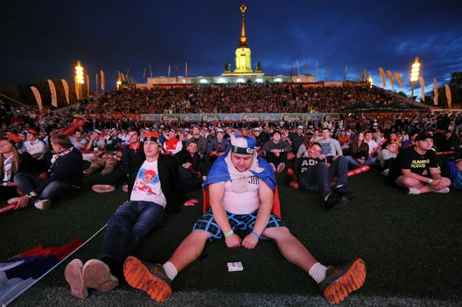 TOPSHOTS Russian football fans reacts while watchin on a giant screen the Group A match between Russia and Greece, in the fan zone in Moscow, on June 16, 2012, during the Euro 2012 football championships. Greece won 1-0. AFP PHOTO/KIRILL KUDRYAVTSEVKIRILL KUDRYAVTSEV/AFP/GettyImages